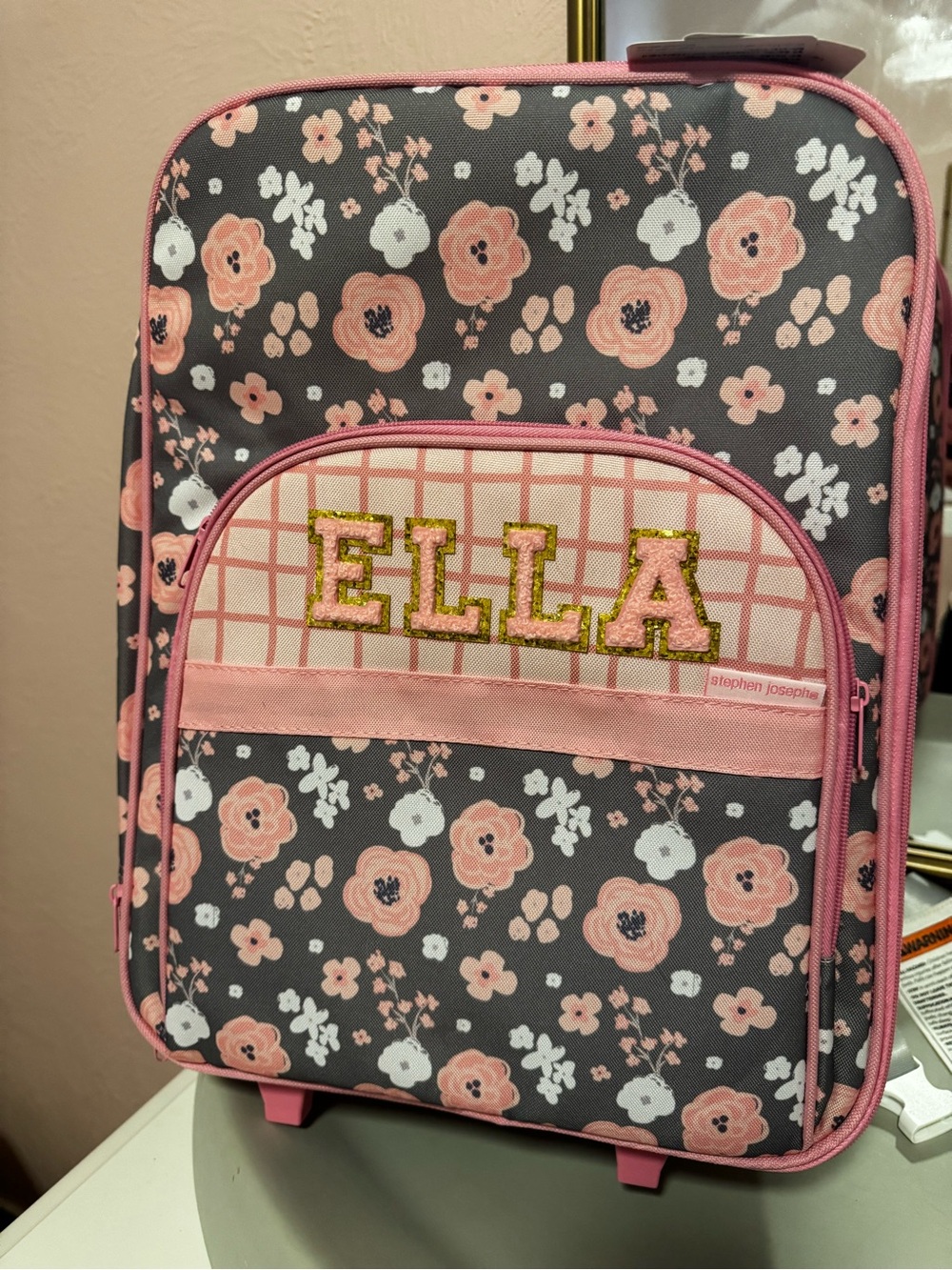 Personalized floral kids luggage with the name Ella. Brand is Stephen Joseph